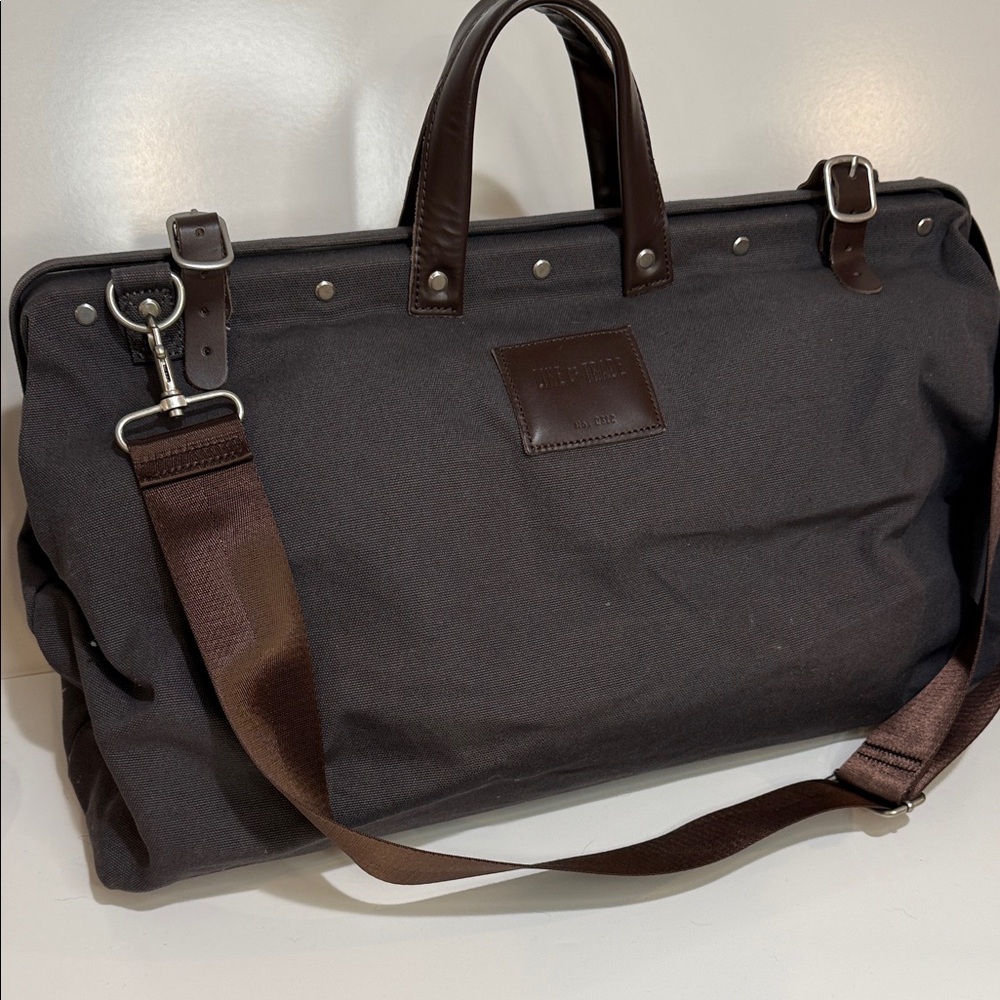 Line of Trade Canvas Weekender Bag. Color Gray. Leather Handles and Trim.
